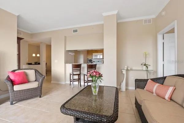 a kitchen with a table chairs sink and cabinets