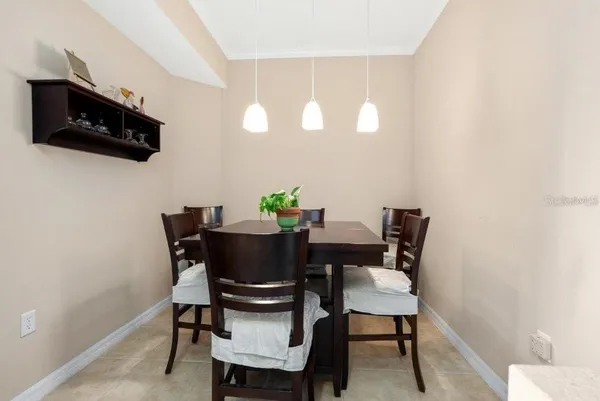 a bedroom with a bed and a potted plant