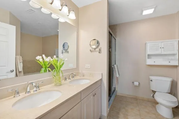 a white bath tub sitting next to a white toilet