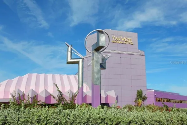 a green field with lots of plants in it