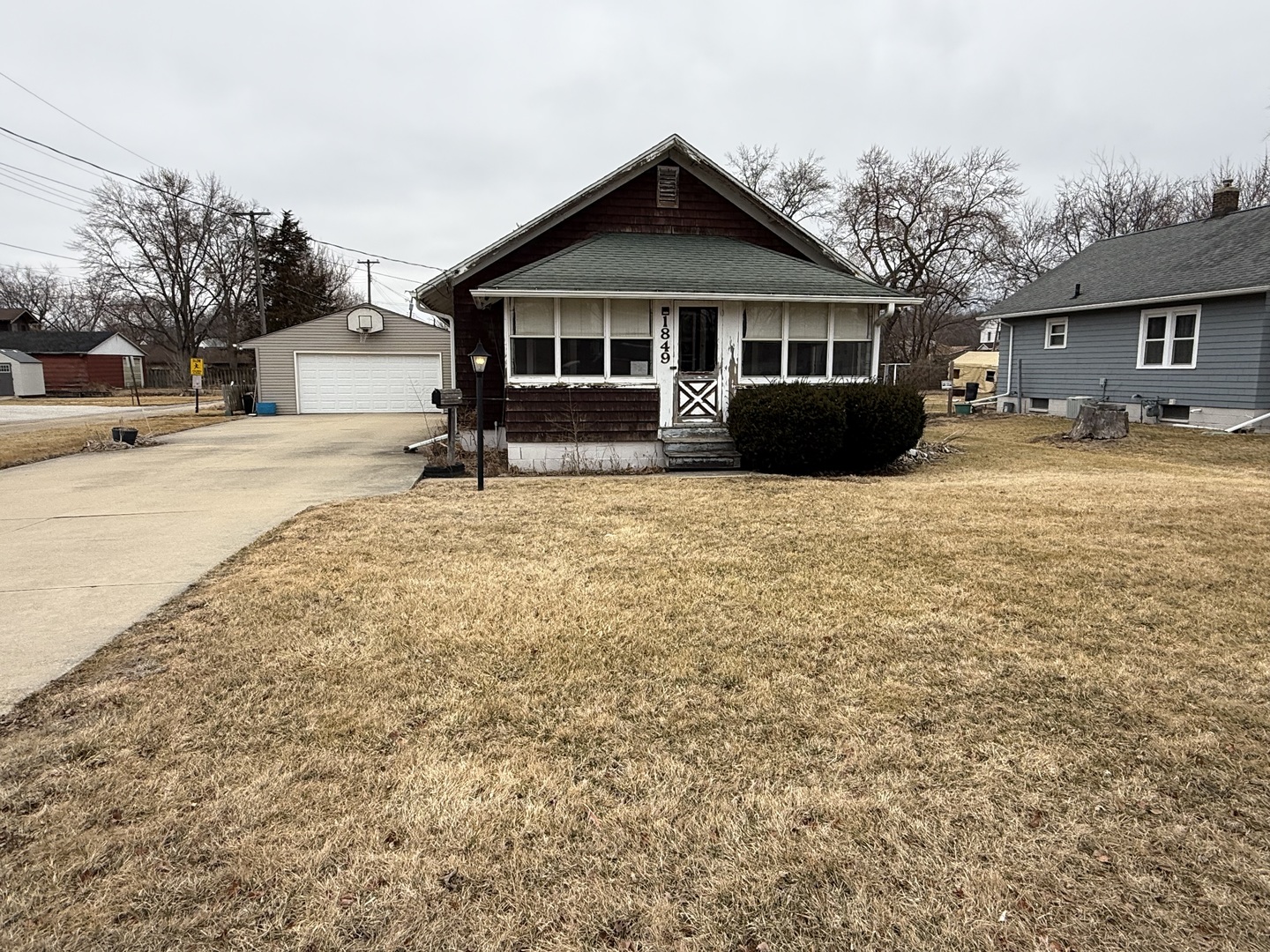a front view of a house with yard patio and fire pit