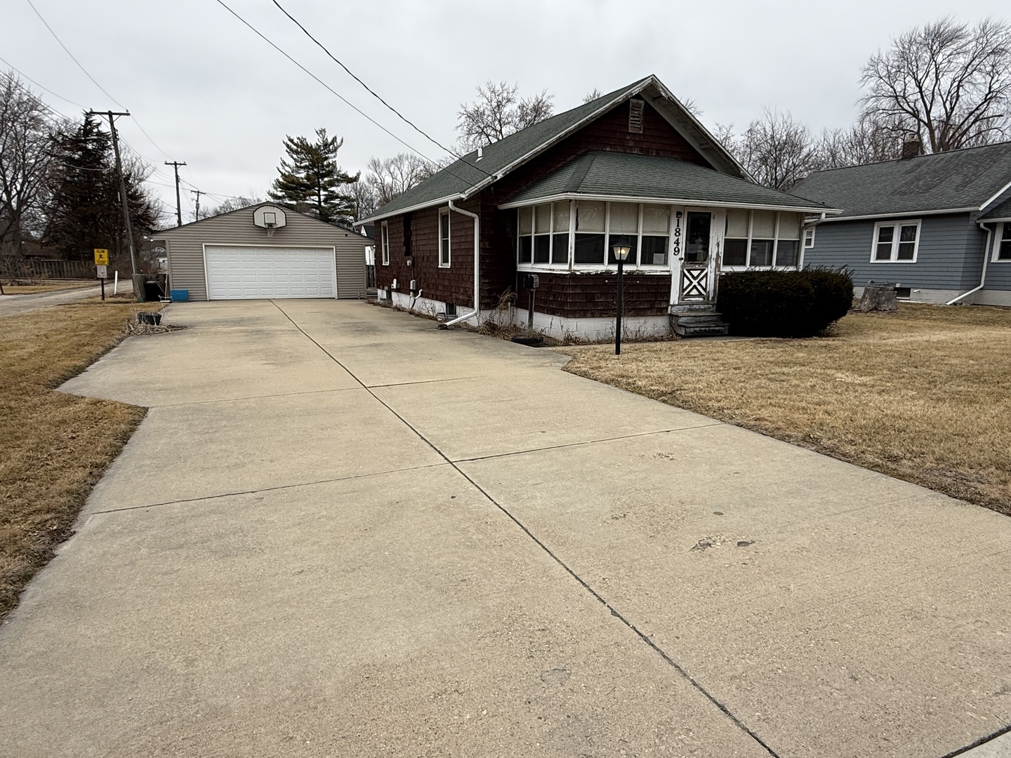 1849 Post Street Ottawa, IL 61350 - Photo 2 of 22 a front view of a house with a yard and garage