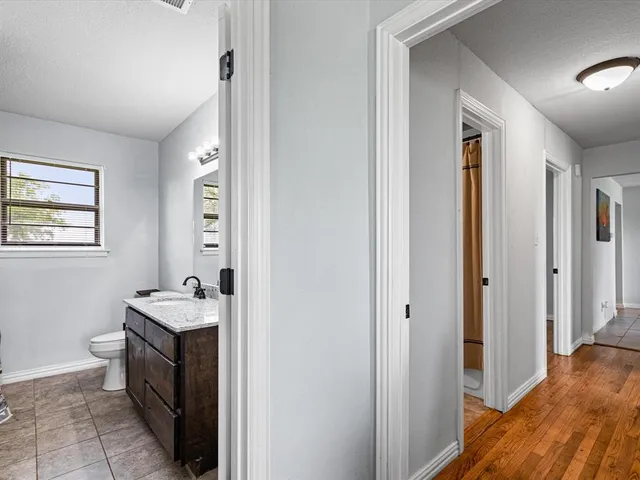 a kitchen with a sink stove and refrigerator