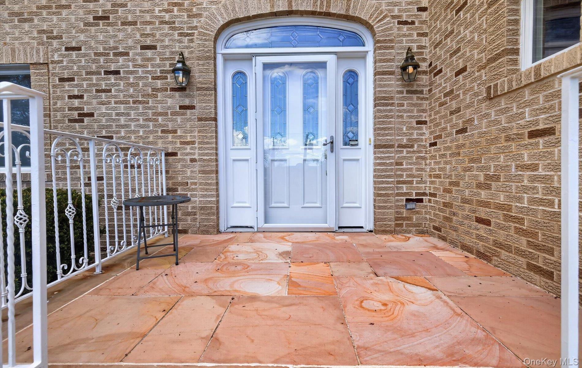 16 East Slope Road Bayville, NY 11709 - Photo 4 of 48 Entryway featuring a white paneled door with decorative glass.