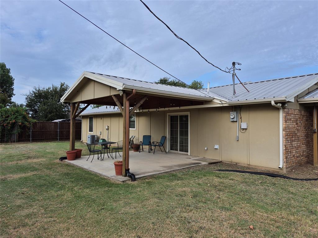 117 Maverick Trail Oak Point, TX 75068 - Photo 14 of 14 a view of a house with a yard and sitting area