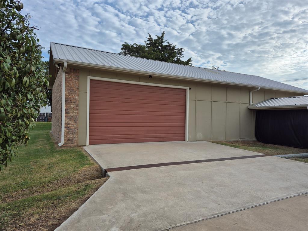 117 Maverick Trail Oak Point, TX 75068 - Photo 2 of 14 a front view of a house with a yard and garage
