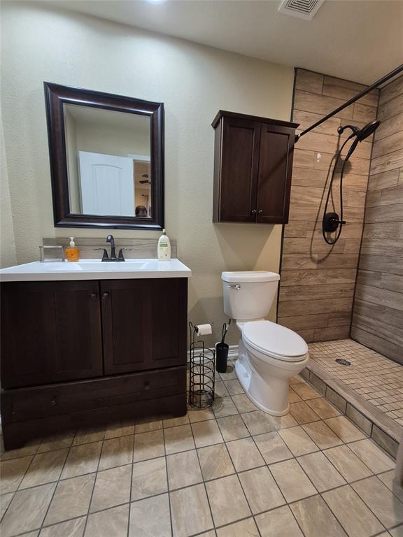 117 Maverick Trail Oak Point, TX 75068 - Photo 6 of 14 a bathroom with a toilet sink and mirror