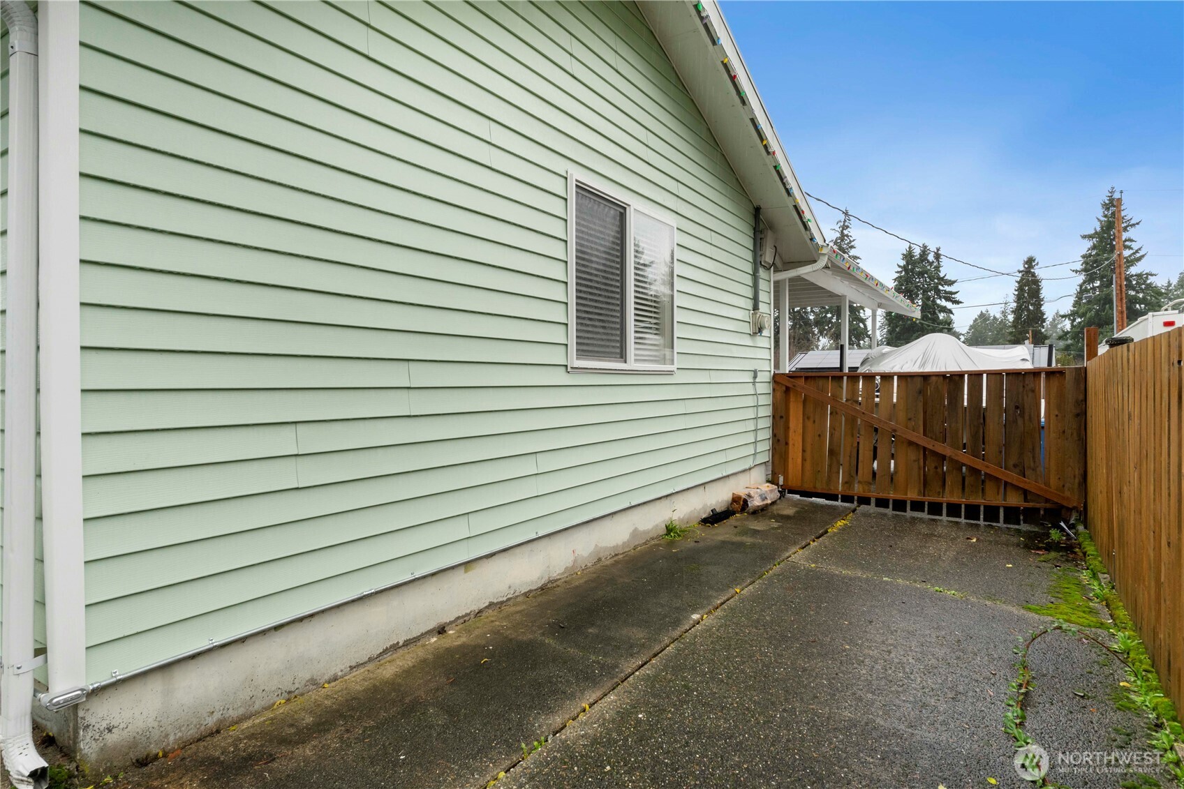 2322 Pamela Place Steilacoom, WA 98388 - Photo 22 of 24 a view of a house with a wooden fence