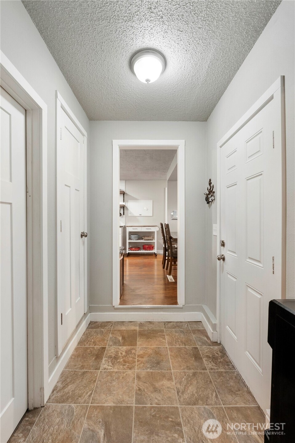 2322 Pamela Place Steilacoom, WA 98388 - Photo 3 of 24 a view of a room with wooden floor cabinet and windows
