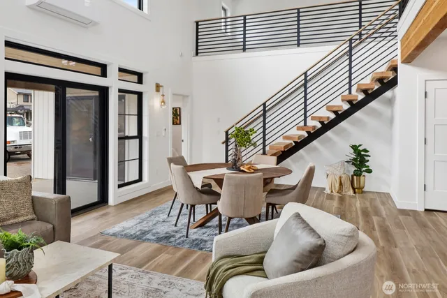 a view of a dining room with furniture and a chandelier