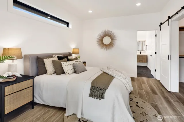 a bedroom with a bed and window