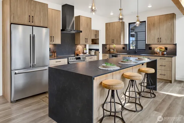 a kitchen with a sink stove and cabinets