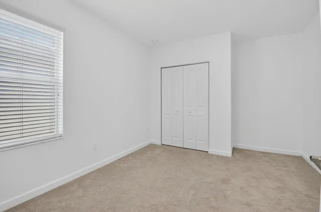 an empty room with closet