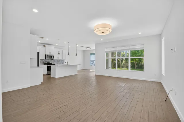 a view of kitchen with wooden floor and windows