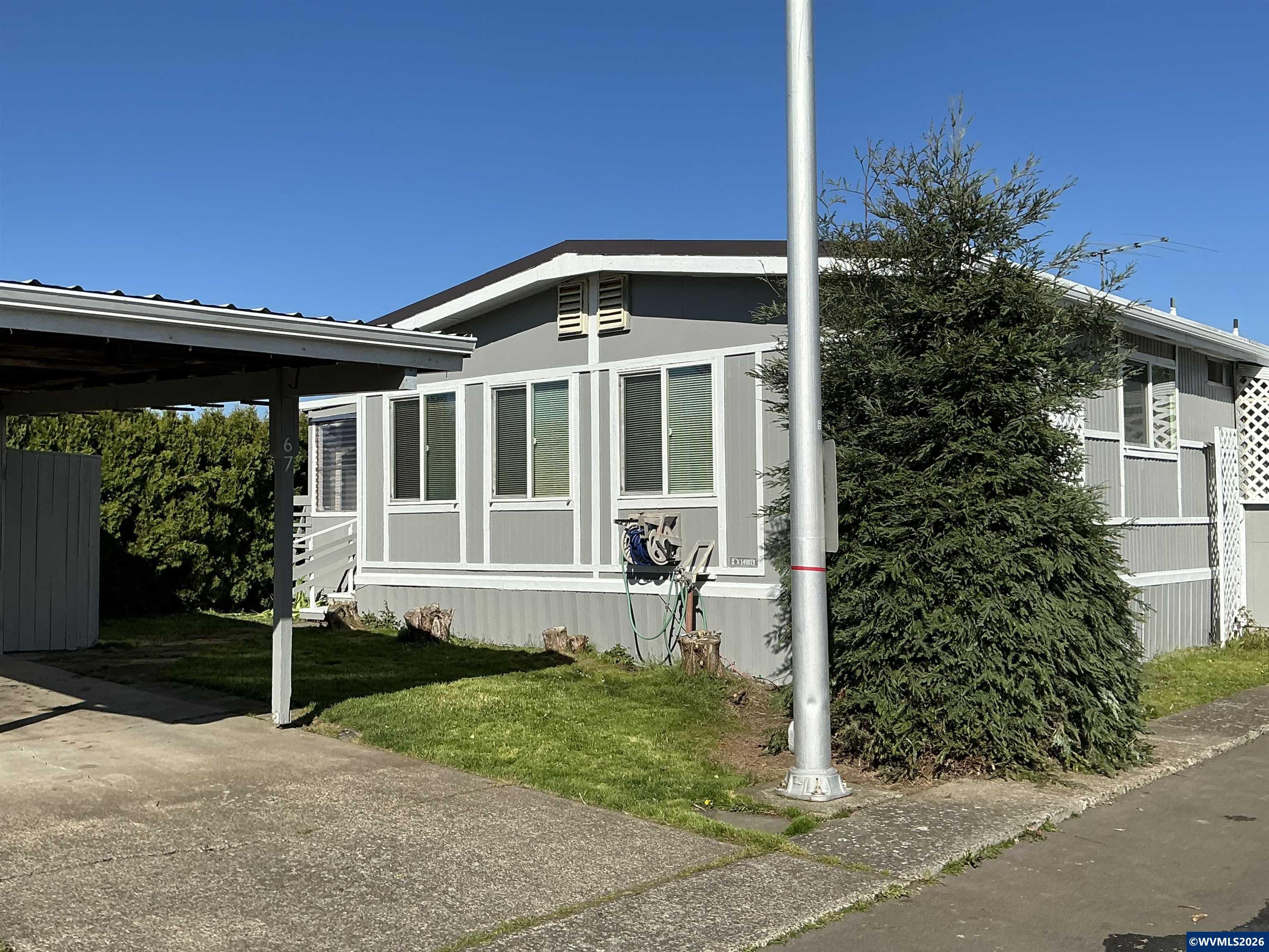 5422 Portland Road Northeast, Unit 67 Salem, OR 97305 - Photo 1 of 45 a view of a house with backyard and garden