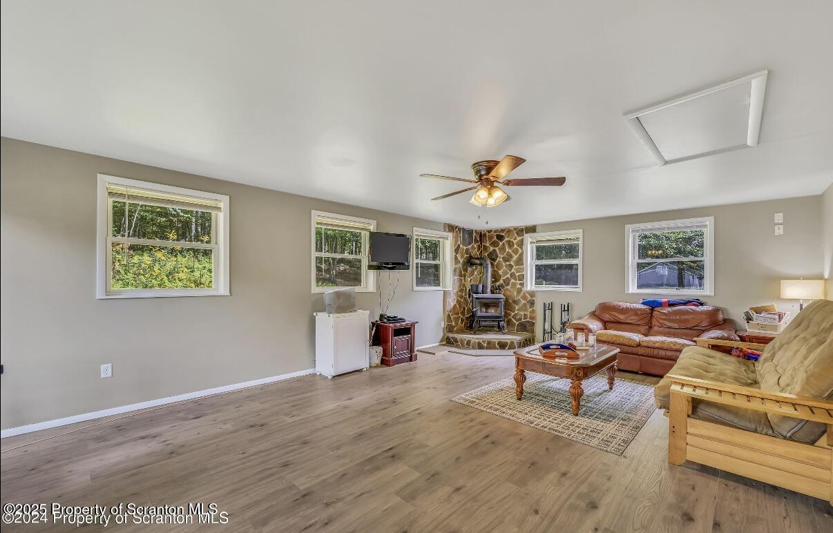 9311 Highway 3004 Springville, PA 18844 - Photo 12 of 51 a living room with furniture and a large window