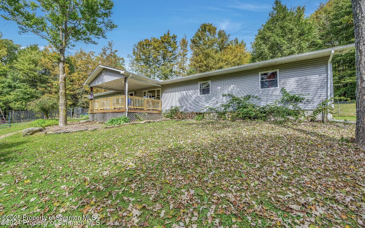 9311 Highway 3004 Springville, PA 18844 - Photo 2 of 51 a front view of a house with garden