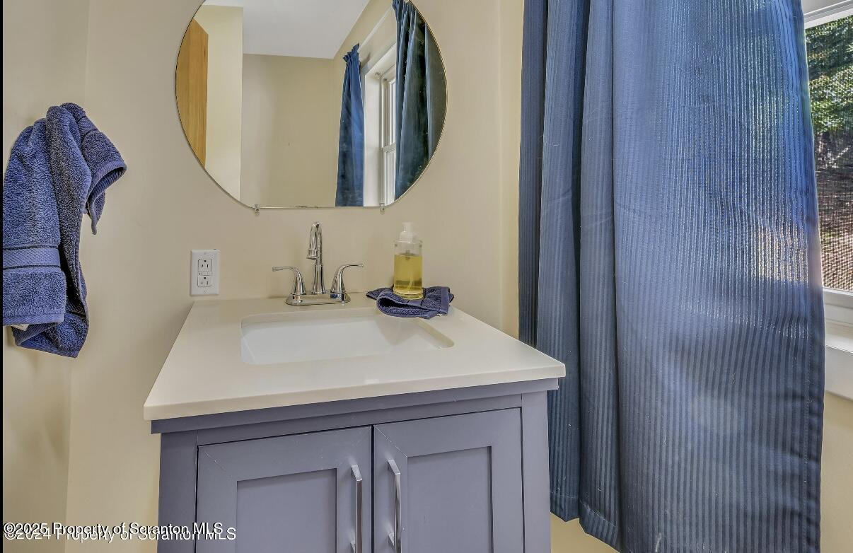 9311 Highway 3004 Springville, PA 18844 - Photo 33 of 51 a bathroom with a sink and a mirror