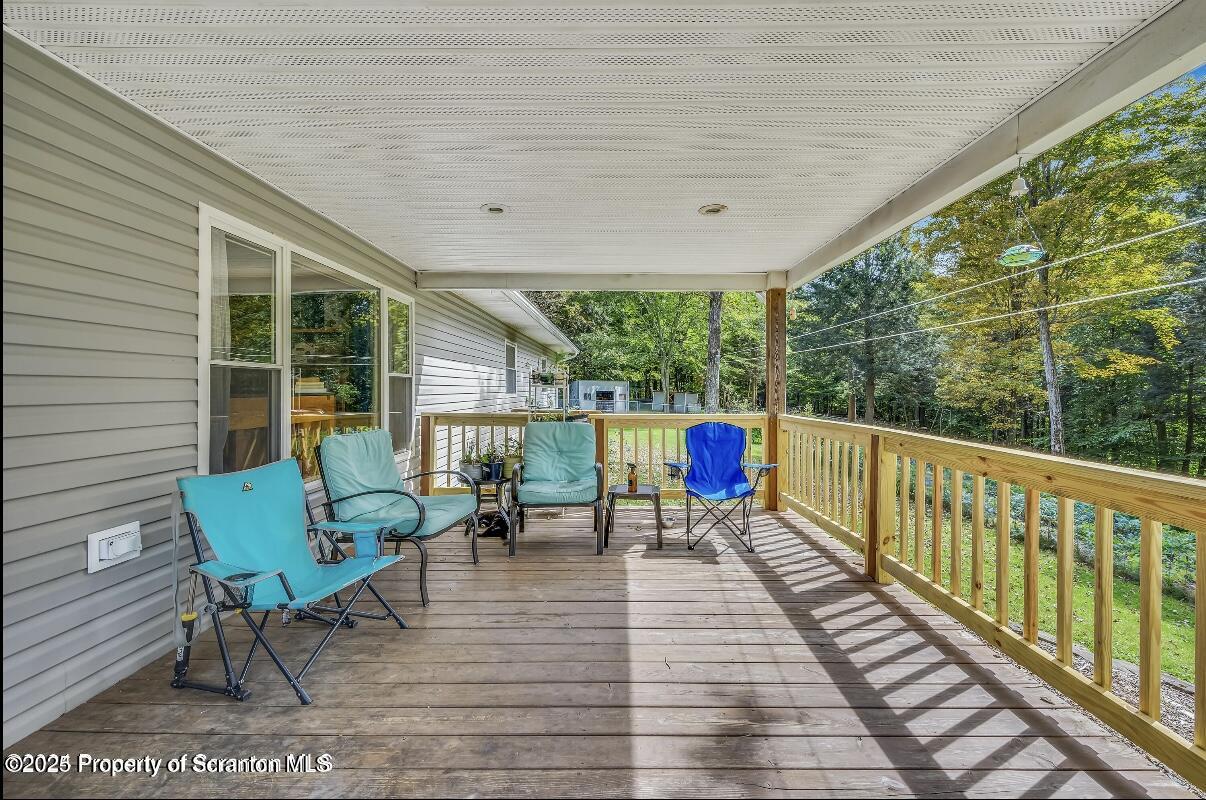 9311 Highway 3004 Springville, PA 18844 - Photo 38 of 51 a balcony with chairs and a table
