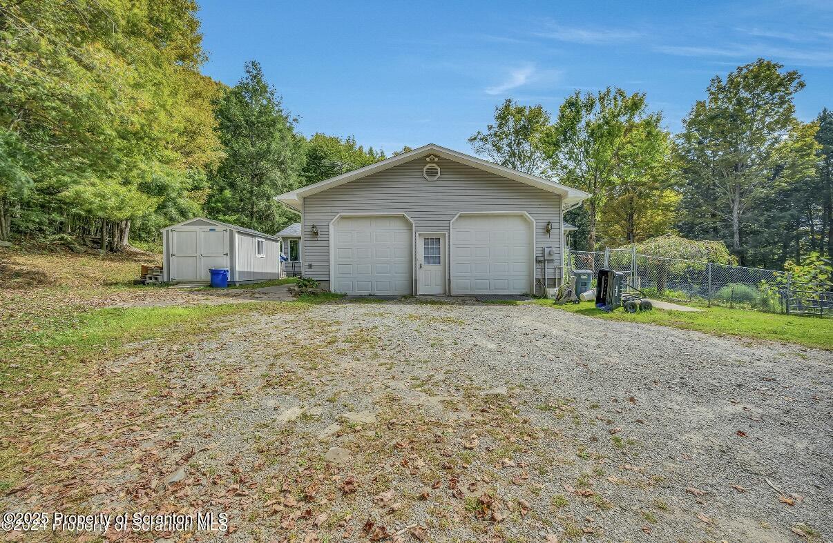 9311 Highway 3004 Springville, PA 18844 - Photo 4 of 51 a view of a house with a yard and a large tree