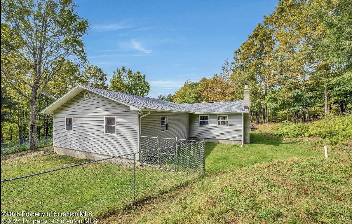 9311 Highway 3004 Springville, PA 18844 - Photo 49 of 51 a view of a house with a yard