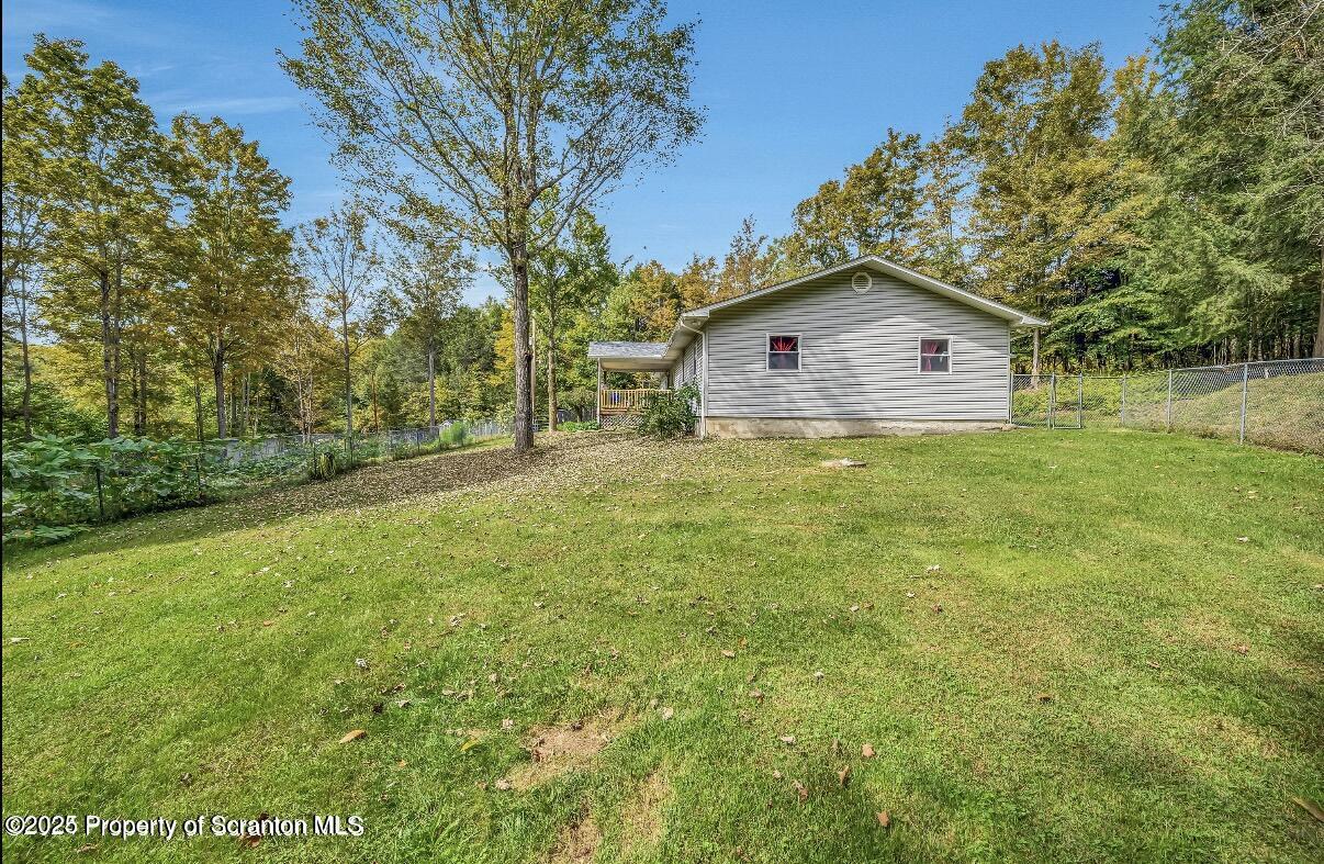 9311 Highway 3004 Springville, PA 18844 - Photo 50 of 51 a house with huge green field in front of it