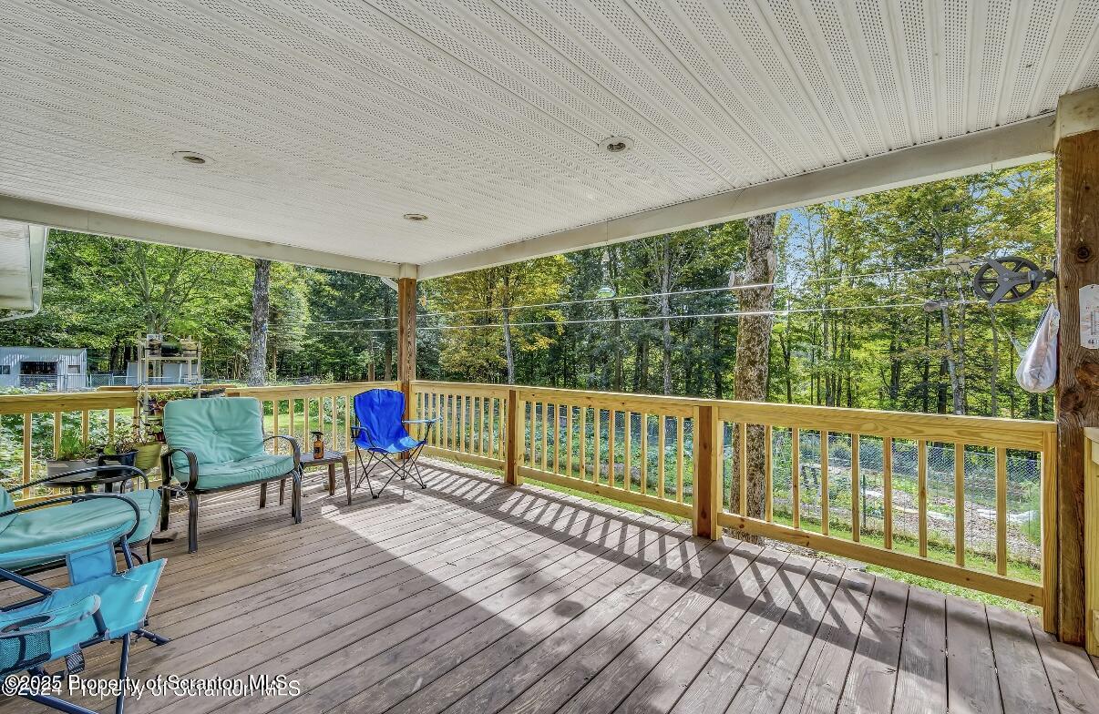 9311 Highway 3004 Springville, PA 18844 - Photo 5 of 51 a view of deck with furniture and garden