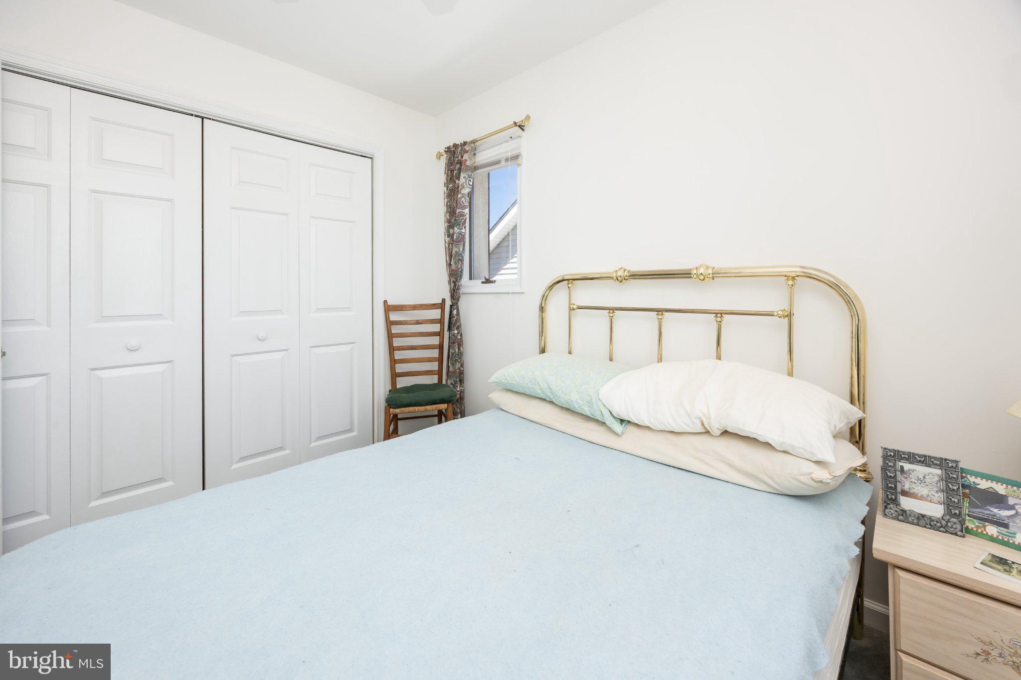10431 Brighton Road Ocean City, MD 21842 - Photo 15 of 39 Cozy bedroom with natural light.