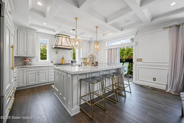 a bathroom with a granite countertop sink a toilet and a mirror