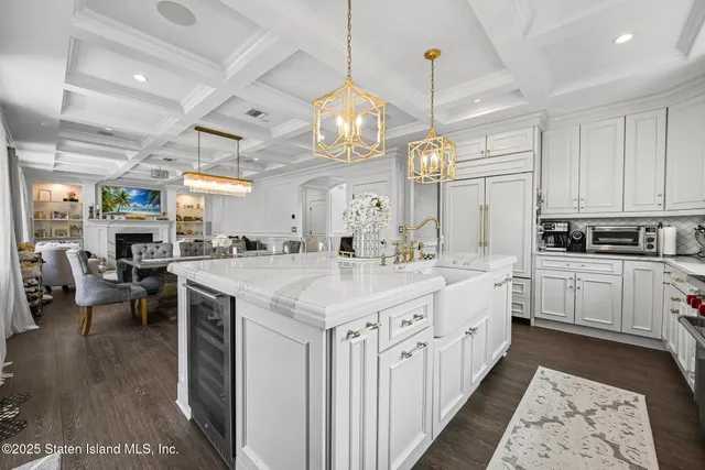 a bedroom with bed and a chandelier