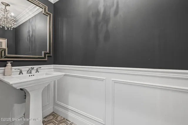 a view of a chairs and table on the balcony