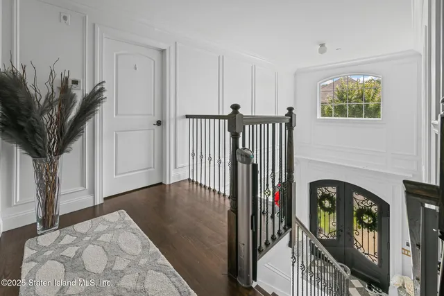 a view of a patio with table and chairs with wooden floor and fence