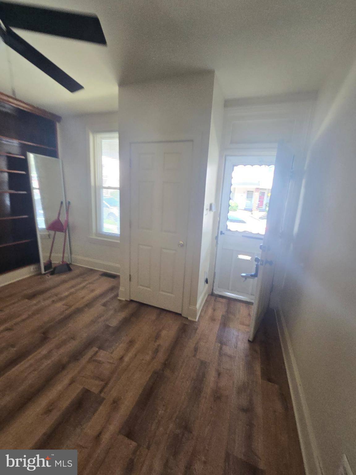 2118 Ruffner Street Philadelphia, PA 19140 - Photo 2 of 20 an empty room with wooden floor and windows