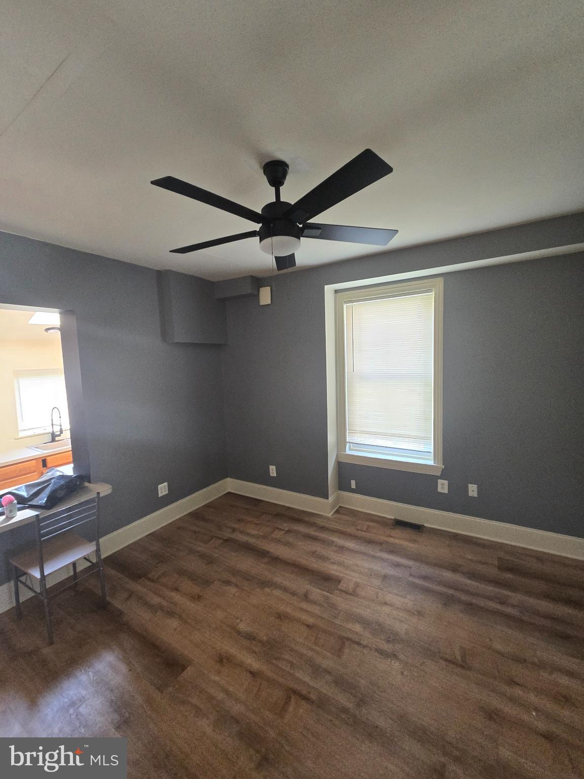 2118 Ruffner Street Philadelphia, PA 19140 - Photo 5 of 20 a view of room with a ceiling fan and wooden floor