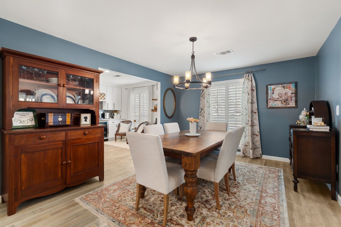 10619 Cranbrook Road Houston, TX 77042 - Photo 5 of 32 Imagine hosting dinner parties under the soft shimmer of a statement chandelier, with plenty of space for loved ones to gather around a grand table.
