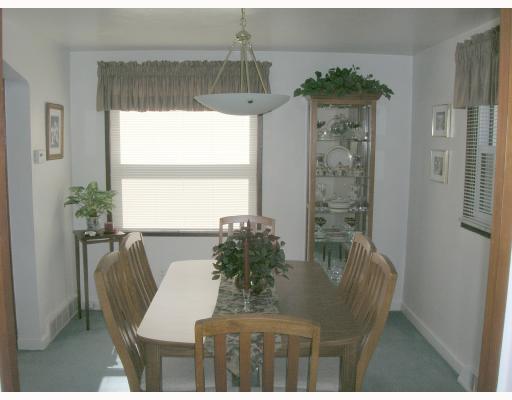 121 Leon Road Green Tree, PA 15220 - Photo 4 of 8 Dining Room. Dining Room with blue carpeting, newer light fixture, and white walls.
