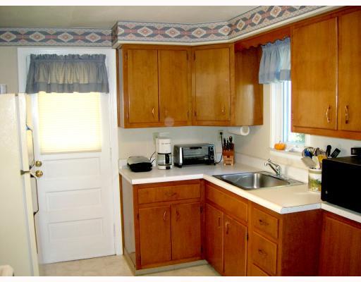 121 Leon Road Green Tree, PA 15220 - Photo 5 of 8 Kitchen. Nice kitchen with wood cabinets, beige vinyl floor. Refrigerator, gas stove and microwave included.
