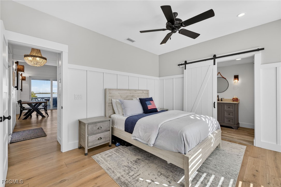 520 Useppa Island Bokeelia, FL 33922 - Photo 21 of 47 a bedroom with a bed and a table