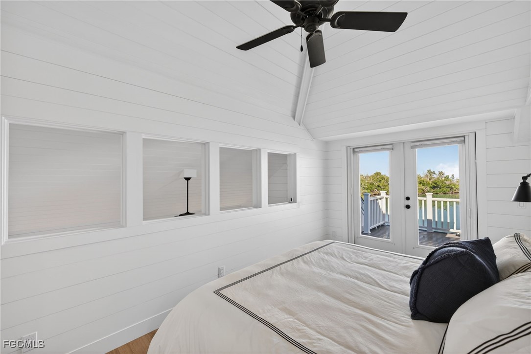 520 Useppa Island Bokeelia, FL 33922 - Photo 26 of 47 a bedroom with a bed window and couch