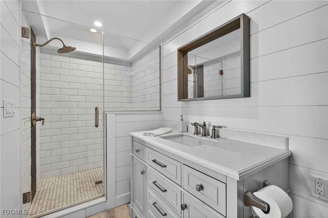 520 Useppa Island Bokeelia, FL 33922 - Photo 28 of 47 a bathroom with a sink and a mirror
