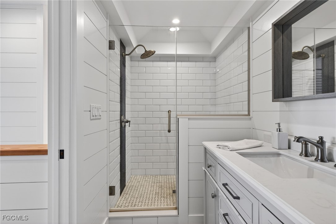 520 Useppa Island Bokeelia, FL 33922 - Photo 29 of 47 a bathroom with a sink shower and a mirror