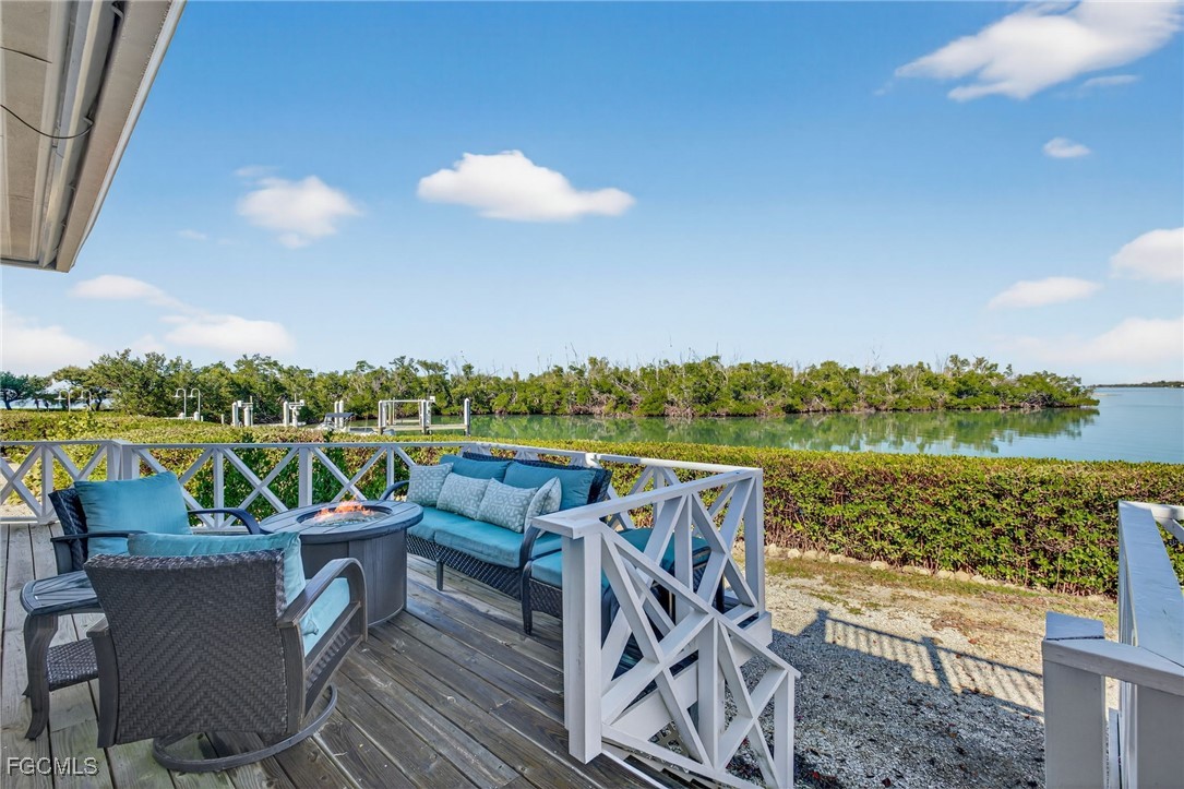 520 Useppa Island Bokeelia, FL 33922 - Photo 36 of 47 a view of a chairs and table in patio