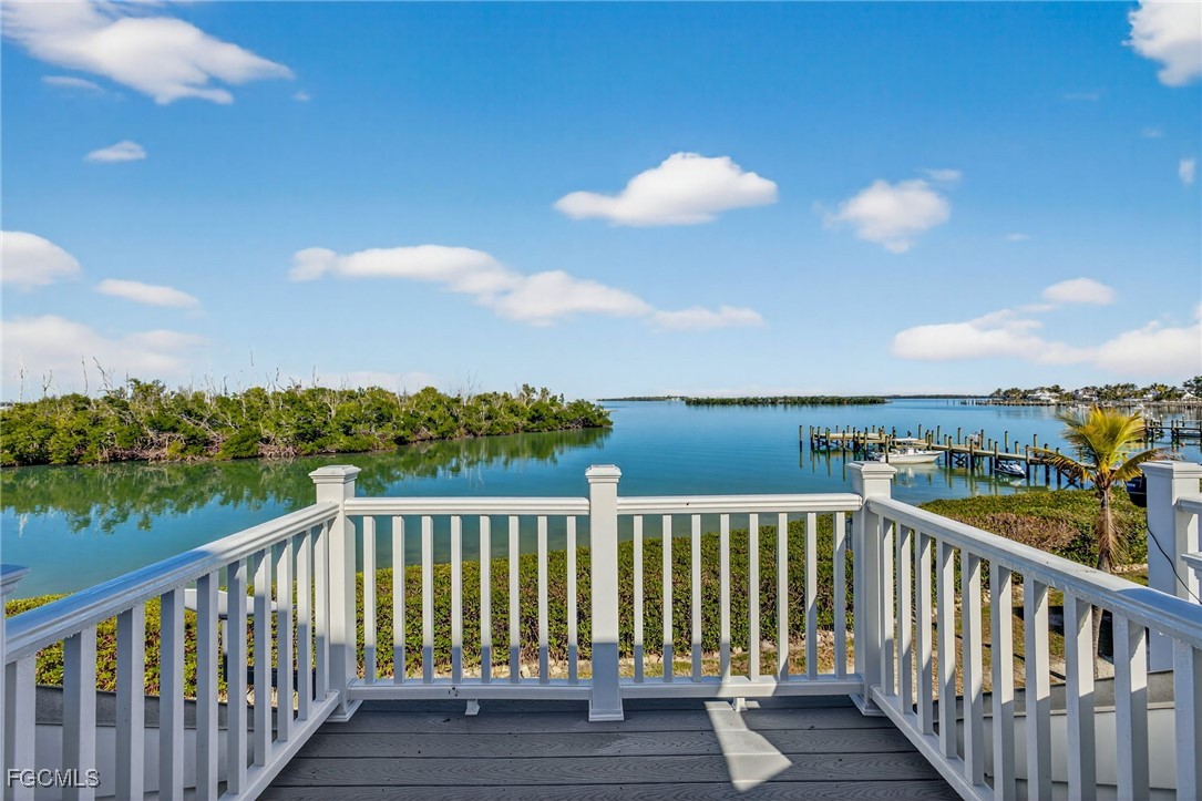 520 Useppa Island Bokeelia, FL 33922 - Photo 37 of 47 a view of a balcony with wooden floor