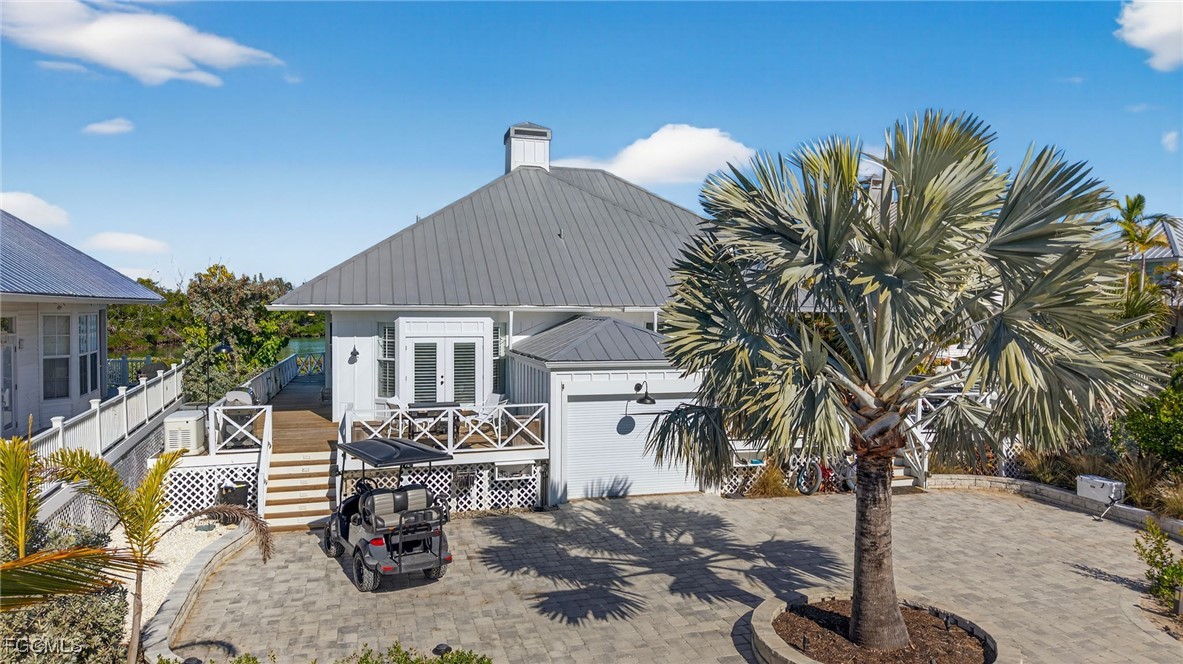 520 Useppa Island Bokeelia, FL 33922 - Photo 4 of 47 a view of a house with backyard and sitting area
