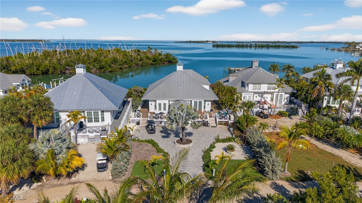 520 Useppa Island Bokeelia, FL 33922 - Photo 42 of 47 an aerial view of a house with a lake view