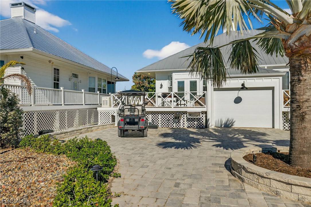520 Useppa Island Bokeelia, FL 33922 - Photo 6 of 47 a view of a chair and tables in the patio