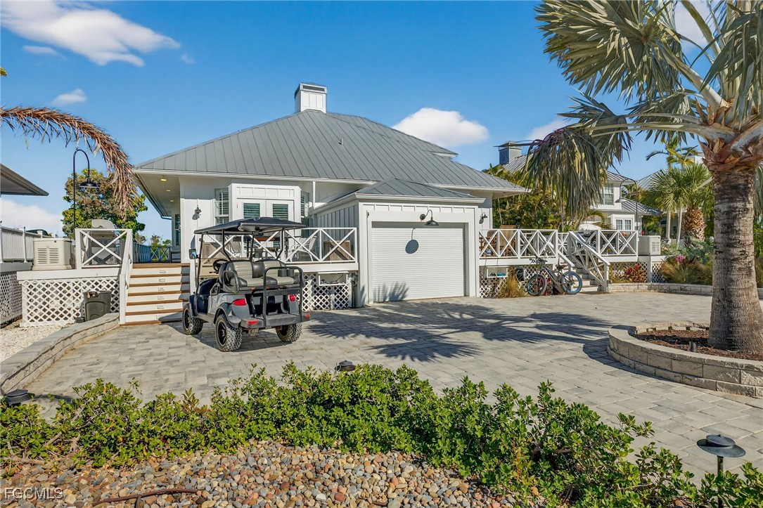 520 Useppa Island Bokeelia, FL 33922 - Photo 7 of 47 a view of a parked car in front of a house
