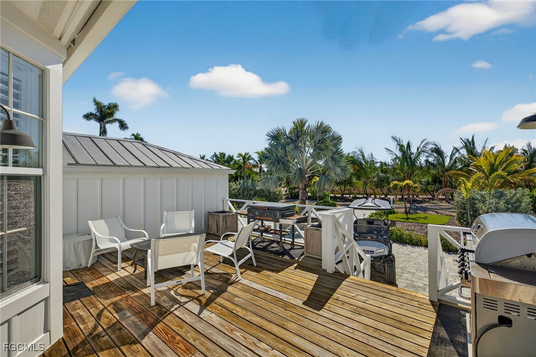 520 Useppa Island Bokeelia, FL 33922 - Photo 8 of 47 a view of a chairs and table in patio
