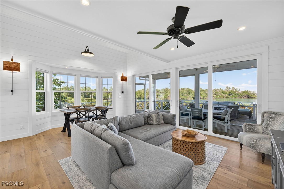 520 Useppa Island Bokeelia, FL 33922 - Photo 10 of 47 a living room with furniture and a large window