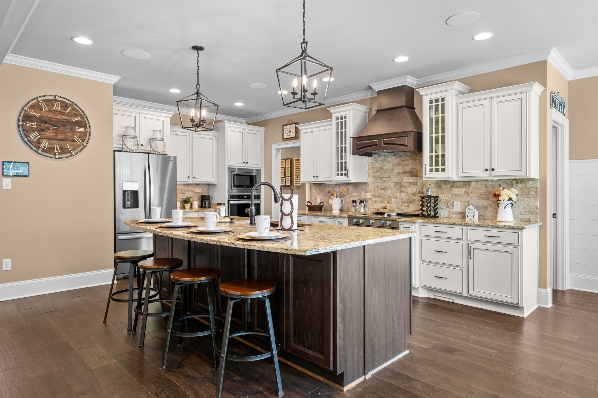1591 North Lovvorn Road Christiana, TN 37037 - Photo 22 of 62 a kitchen with stainless steel appliances kitchen island granite countertop a dining table chairs and white cabinets